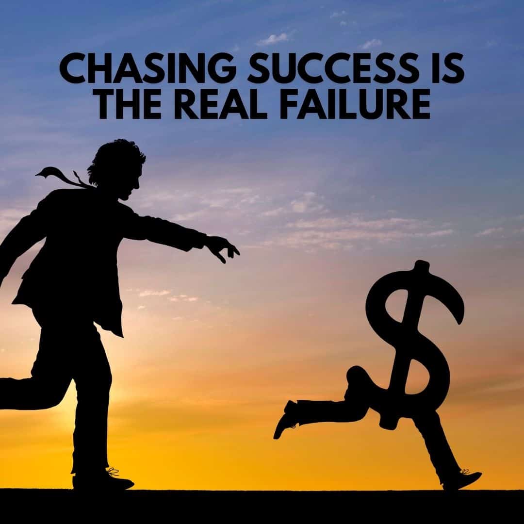 A silhouette of a person, embodying modern manhood, chases a running dollar sign against a sunset sky. Above, the text reads, "Chasing success is the real failure.