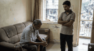 Father apologizing to son for past mistakes, expressing regret and seeking reconciliation.